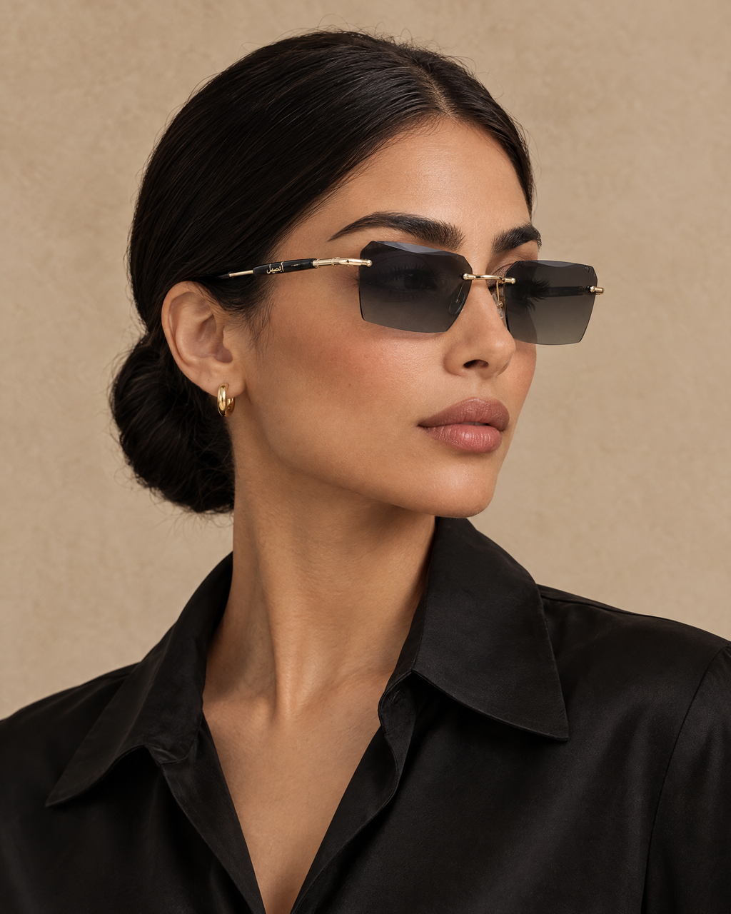 Woman wearing Fahd black and gold sunglasses