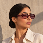 Woman wearing Jouri burgundy oval sunglasses