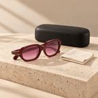 Woman in profile wearing Jouri burgundy sunglasses